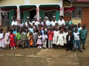 staff and children pose a photo after the children's party